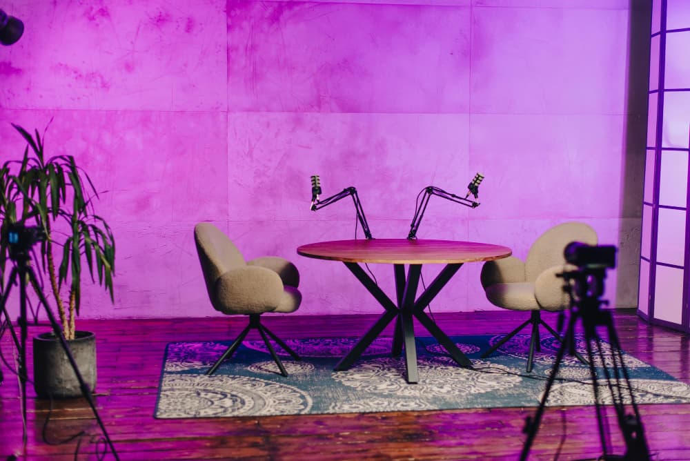 Podcast studio bathed in pink light